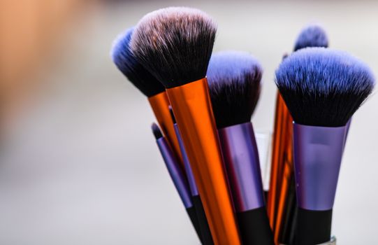 Clean and dirty professional makeup brushes isolated.