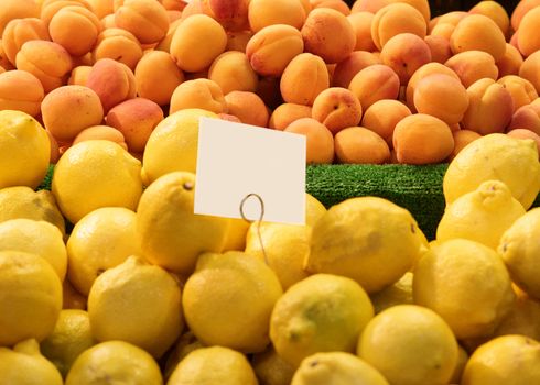 fresh lemons and peaches in a market