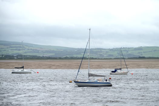 some boats in the bay in autumn