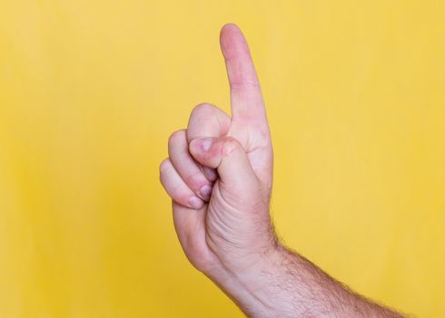 Man hand showing direction by one finger