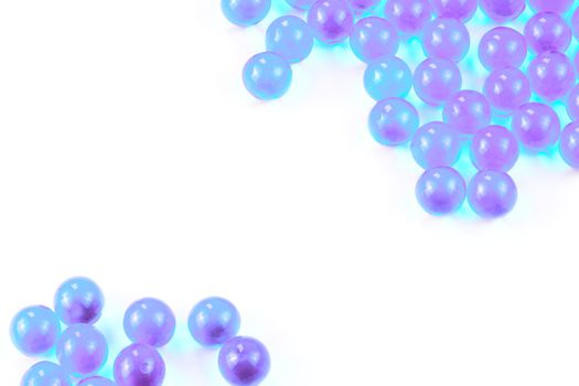 cyanspherical ball capsules with selective focus isolated on white background.