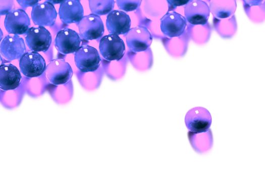 proton purple spherical ball capsules with selective focus isolated on white background.