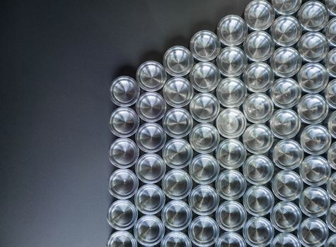 Shiny metal parts after cnc turning, on flat surface top-down flat lay background.