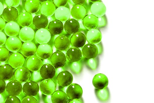 proton purple spherical ball capsules with selective focus isolated on white background.