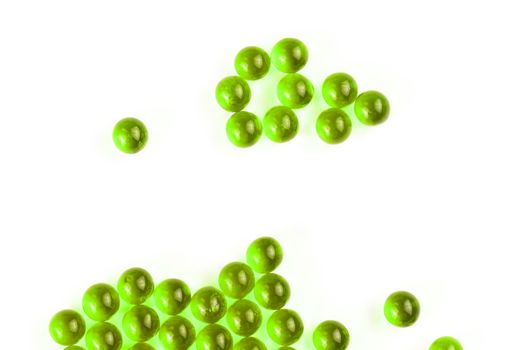 proton purple spherical ball capsules with selective focus isolated on white background.