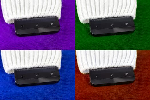 a set of cellphone sticking out from knitted fabric like sweater or mittens.