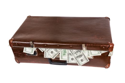 old closed brown suitcase full of hundred dollar banknotes isolated on white background.