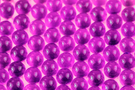 proton purple spherical ball capsules selective focus weird abstract background.