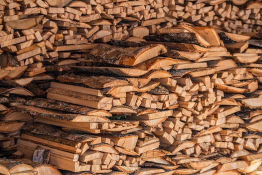 closeup background of firewood lumber leftovers stack with selective focus.
