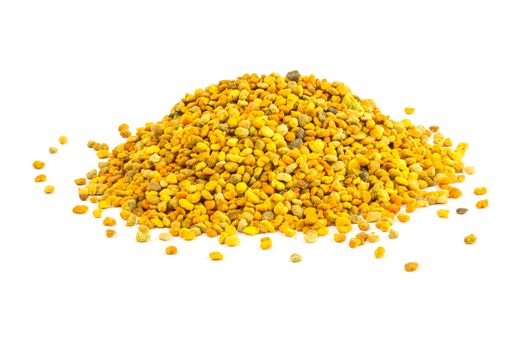 a small heap of bee pollen anules isolated on white background.