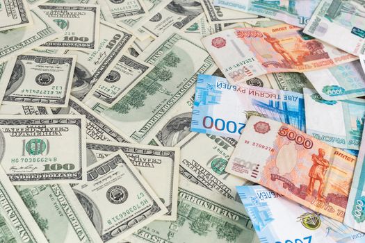 russian rubl and us dollar banknotes close-up with selective focus and blur