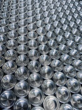 Shiny metal parts after cnc turning, on flat surface selective focus composition background.