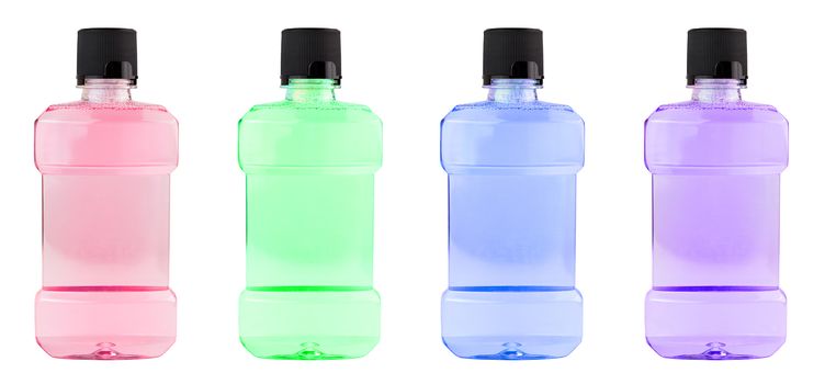 A set of colored plastic bottles of water mouthwash isolated on white background.