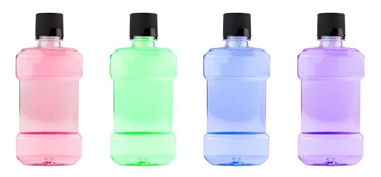 A set of colored plastic bottles of water mouthwash isolated on white background.