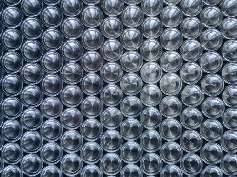 Shiny metal parts after cnc turning, on flat surface top-down flat lay background.