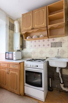 View of the old kitchen set in the interior of the kitchen in need of repair