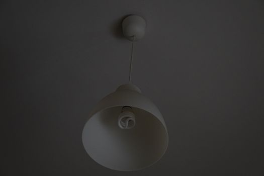 a white lamp fixed in the ceiling.