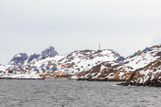 Colorful arctic village houses at the rocky fjord  in the middle of nowhere, Kangamiut, Greenland