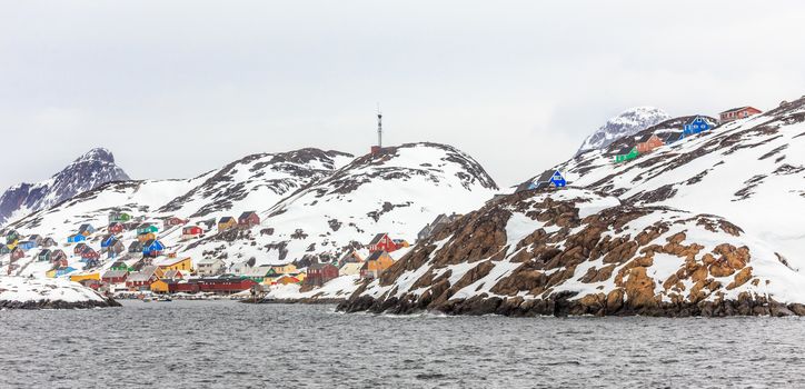 Colorful arctic village houses at the rocky fjord  in the middle of nowhere, Kangamiut, Greenland