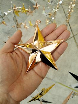 Man Hand and decoration star and Merry Christmas and Happy new years.