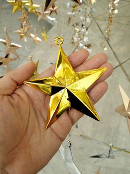 Man Hand and decoration star and Merry Christmas and Happy new years.