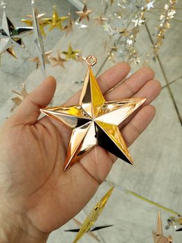 Man Hand and decoration star and Merry Christmas and Happy new years.