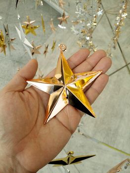 Man Hand and decoration star and Merry Christmas and Happy new years.