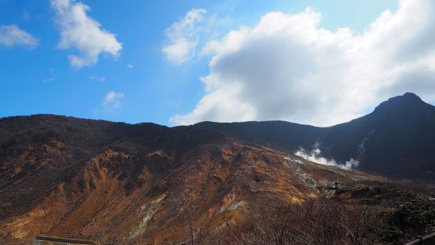 Hill and clear blue sky and white clouds and outdoor nature landscape.