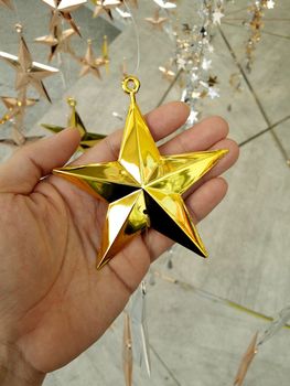 Man Hand and decoration star and Merry Christmas and Happy new years.