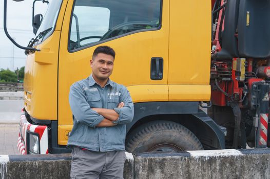 Smile is confident that the truck driver is a mature Asian professional in the transportation and delivery business.