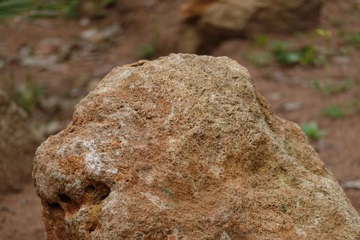 a brown rock in a High quality Photo.