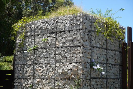 a cube of rock and plants