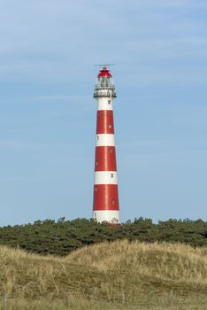 The red and white striped lighthouse of the Wadden island of Ameland in the north of the Netherlands