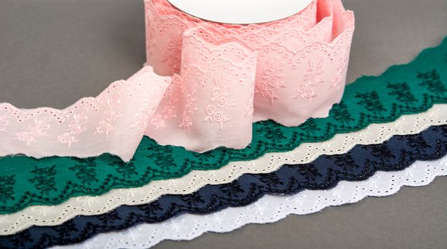 mockup label reel coil of color cotton natural tapes ribbon. Framing for clothing and traditional dresses in rustic style. Use for sew and tailor