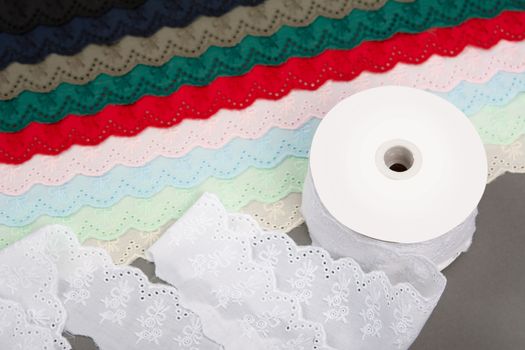 mockup label reel coil of color cotton natural tapes ribbon. Framing for clothing and traditional dresses in rustic style. Use for sew and tailor
