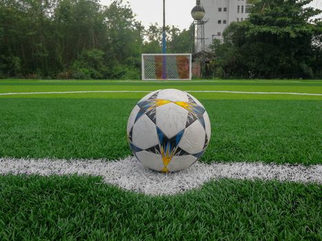 Football field, astro turf surface. Close up of throw in, kick off and corner area. Lushed green football pitch.