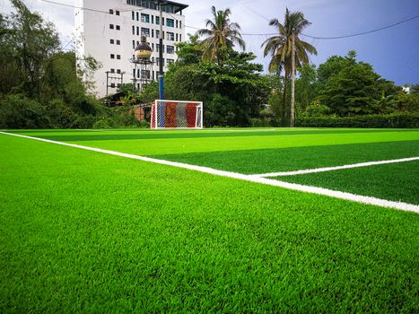 Football field, astro turf surface. Close up of throw in, kick off and corner area. Lushed green football pitch.