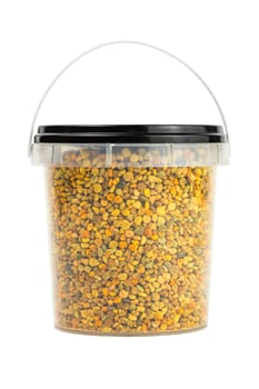 bee pollen granules in small closed plastic container isolated on white background