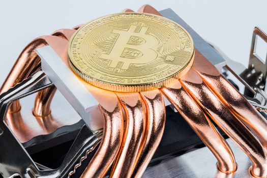 Bitcoin shiner cooling on modern tower heat radiator with six copper heatpipes.