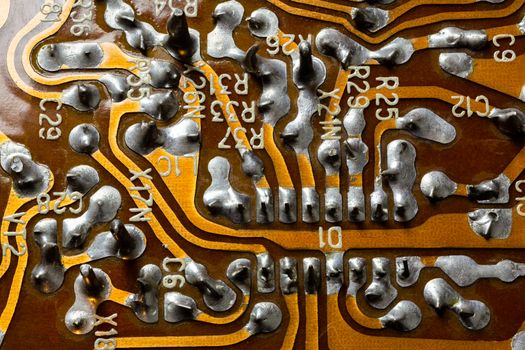 back side of old flat textolite pcb without components with selective focus