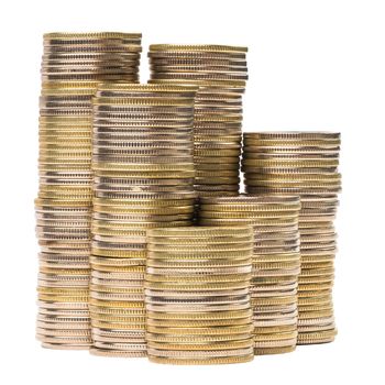 Small group of close standing coin stacks isolated on white background. Same coins - differend shades caused differend age of each coin - from one to six years.