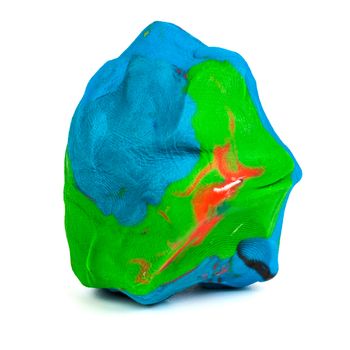 Mixed blue-green-red playdough ball with distinct fingerprints isolated on the white background. Front to end sharp. Small dust particles on surface.