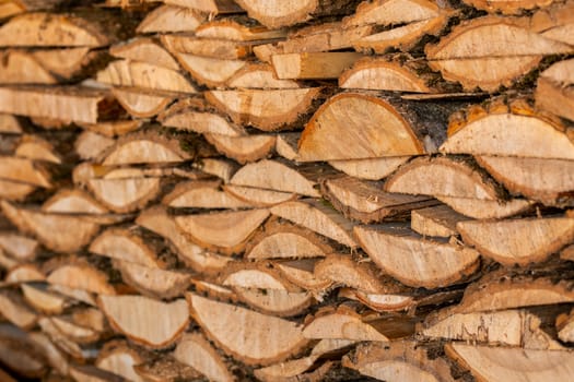 closeup background of firewood lumber leftovers stack with selective focus.