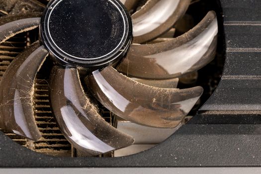 dusty video card cooling fan closeup with selective focus.