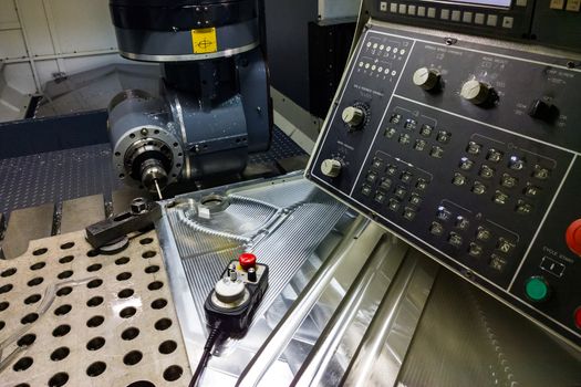 Measuring process with ruby touch probe on large CNC milling machine in jog mode.