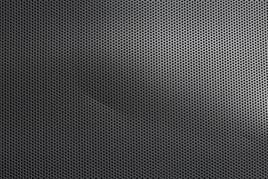 Black mesh screen background and texture with round hexagonal holes, with defect and selective focus