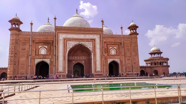 Grand imperial sandstone Persian style domed mausoleum Humayun Tomb in the landscaped char-bagh garden. A finest example of Mughal architecture and iconic structures. New Delhi India May 2019