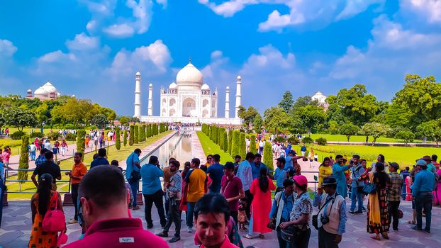 Crowed of people and visitors arrive in the Taj Mahal in sunset time. High crowds gathered in Taj Mahal in holiday weekends. Agra Uttar Pradesh India Asia Pacific May 2019