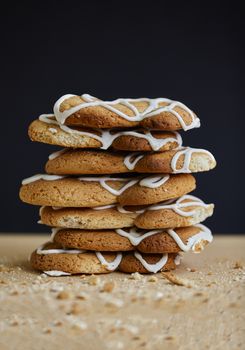 Stack of handmade cookies on wooden table, studio photo
