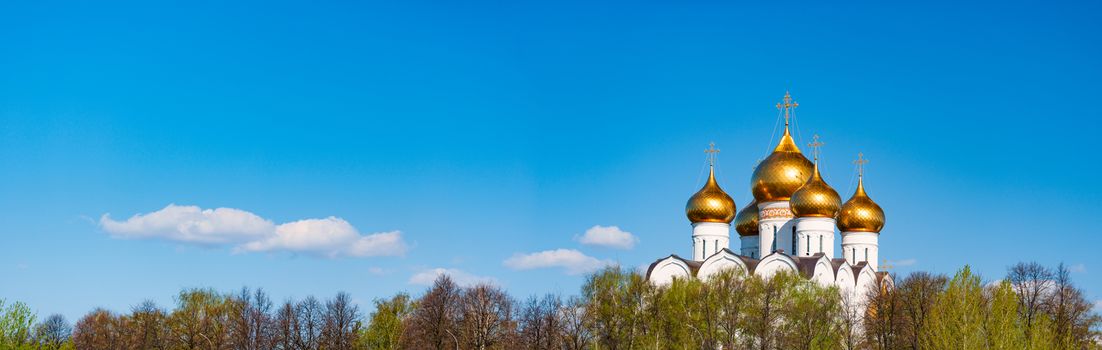 Old church in Yaroslavl, Russia, Europe. Panoramic photo with blue cloudy sky in background. Travel and religion.